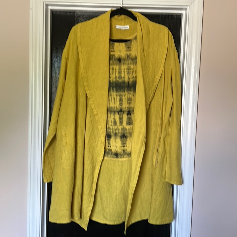Bryn Walker yellow open front jacket and tie dyed yellow and black tank.